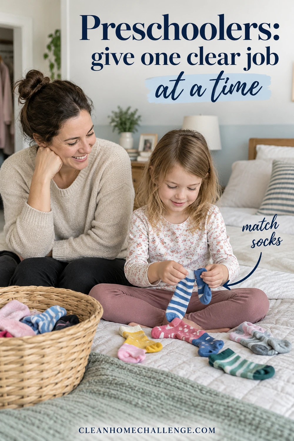 A preschooler matches striped socks with her mother beside a laundry basket.