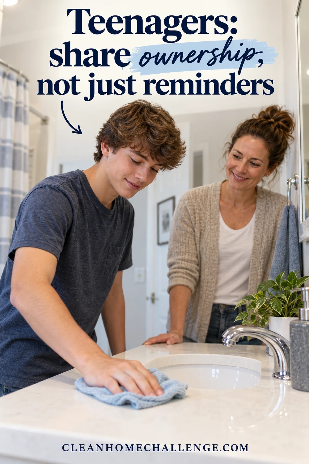 A teenager wipes a bathroom counter with a cloth while a parent watches.