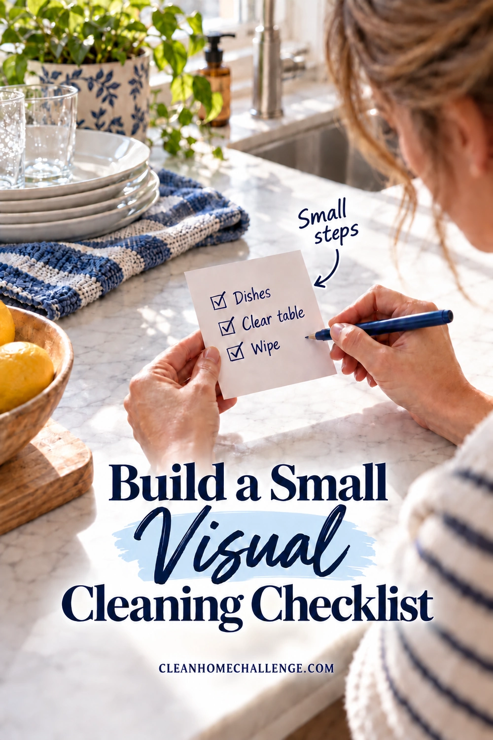 A woman checks a small kitchen card with three steps beside a blue cloth and used breakfast dishes.