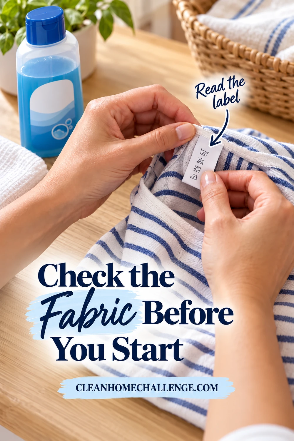 Hands hold out the care tag inside a blue-and-white striped shirt beside a closed blue laundry bottle and a folded white cloth.