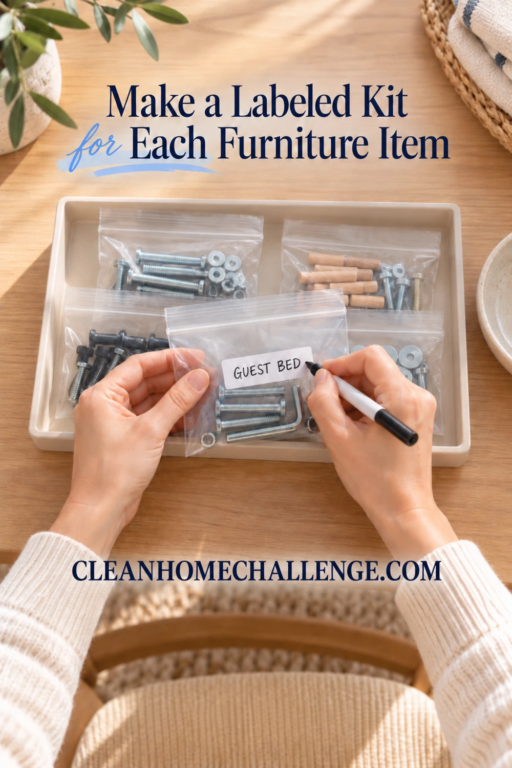 Hands writing Guest Bed on a hardware pouch containing bolts and an Allen key over a tray of separate packets.