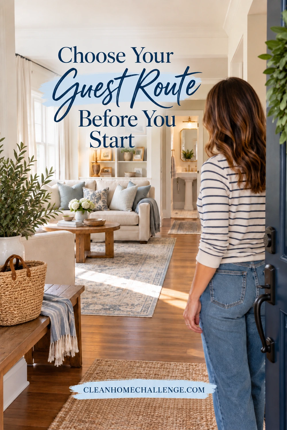 A woman stands at an open front door looking along a clear path to a living room and guest bathroom.