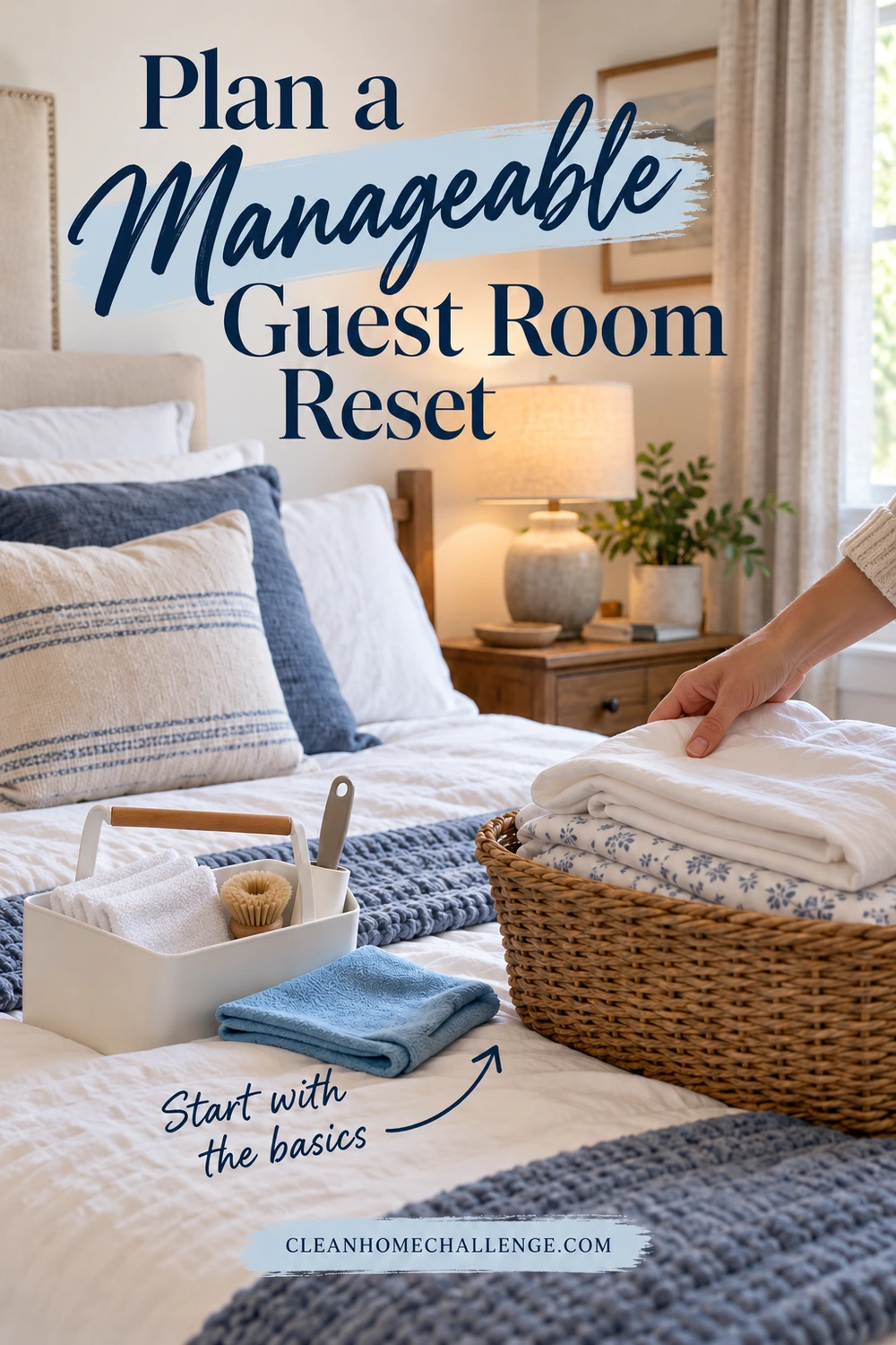 An adult hand rests on folded sheets in a wicker basket on a guest bed beside a caddy of cloths and a small brush, with a blue cloth in front.