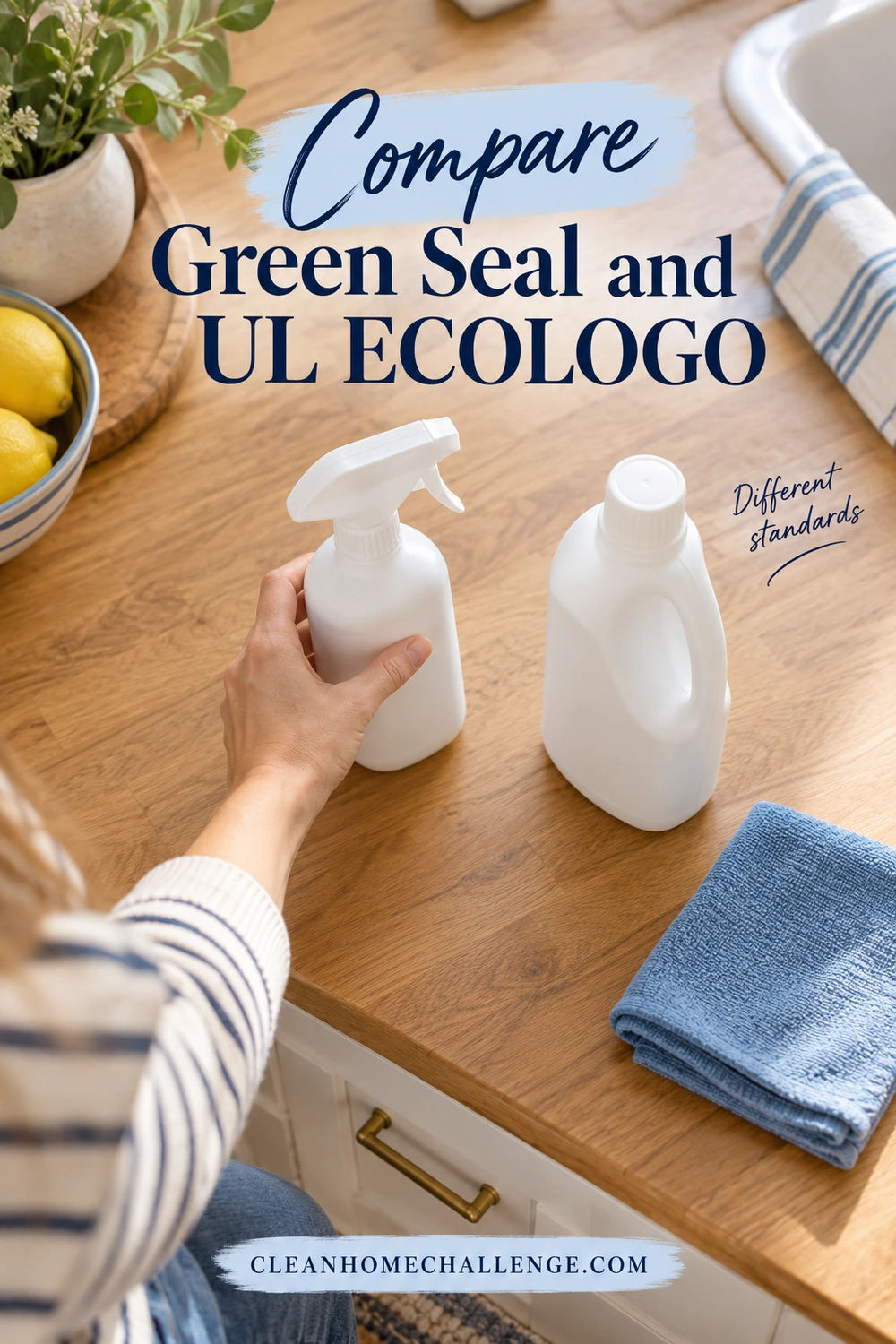 Overhead view of a hand holding one of two white cleaning containers on a wooden counter beside a folded blue cloth.