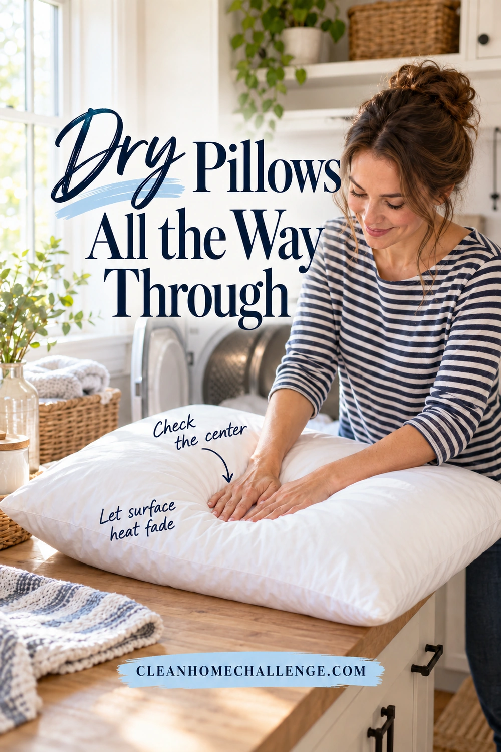A woman presses both palms into the center of a white pillow supported on a wood laundry counter, with an open dryer behind her.