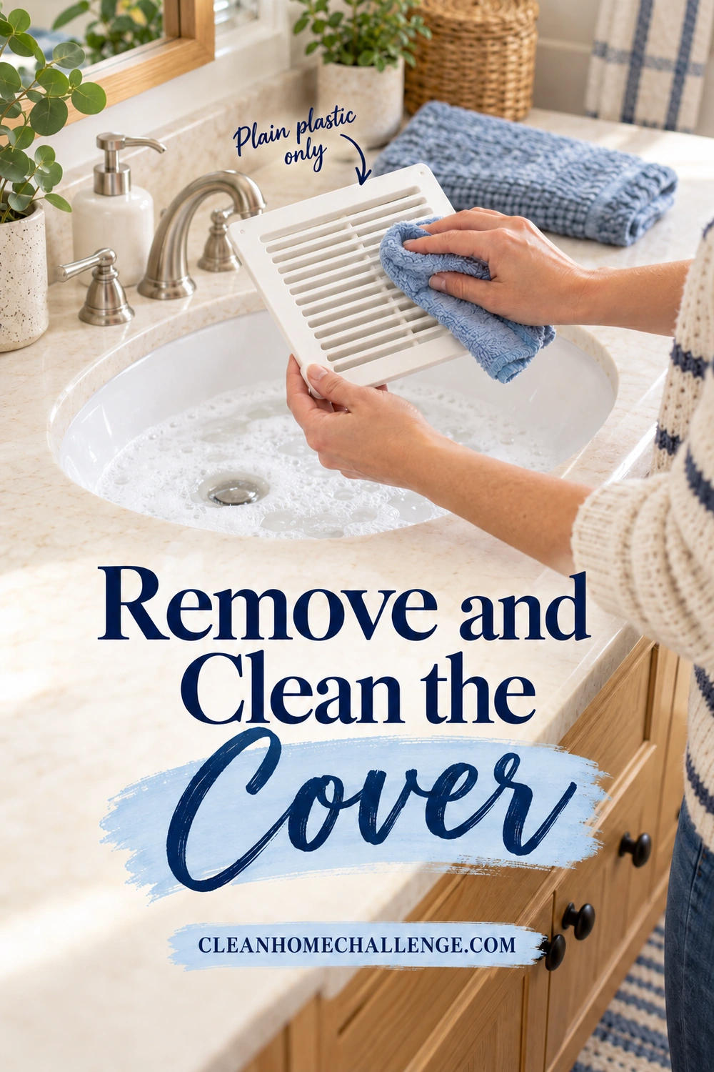 Hands gently wash a detached plain plastic bathroom fan grille over a sink, with no motor or electrical parts attached.