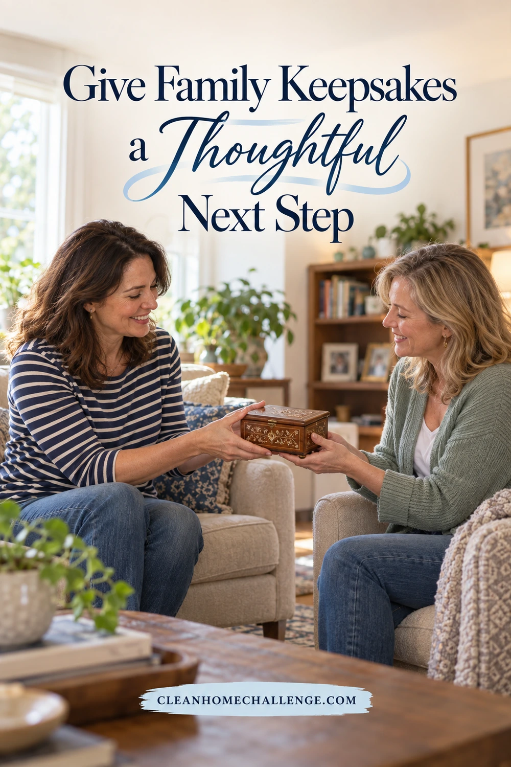 Two smiling women seated in armchairs pass a small decorated wooden keepsake box between them.