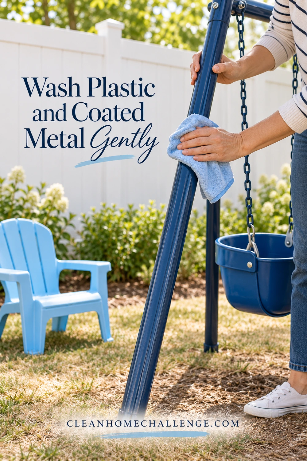 Hands gently wipe a blue coated-metal swing frame with a pale-blue cloth beside a small plastic chair.