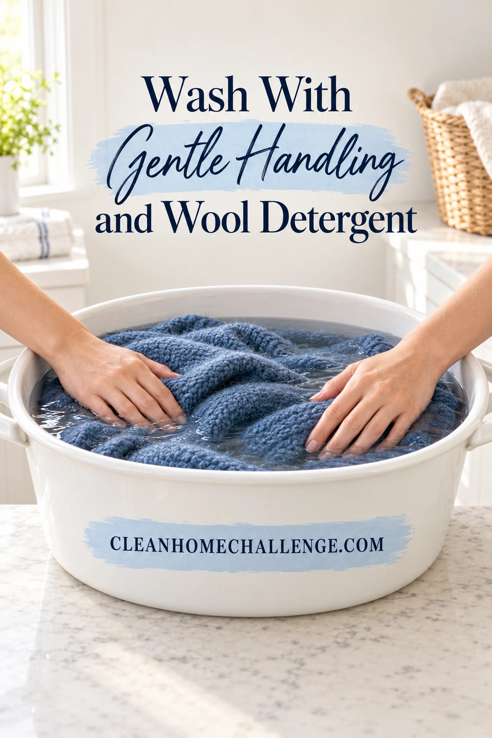 Two hands rest lightly on a dark blue wool blanket supported in a white basin.